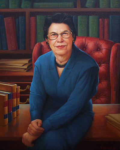 A photograph of an oil painting depicting an older woman in a blue skirt suit seated on a wood desk in front of a bookshelf